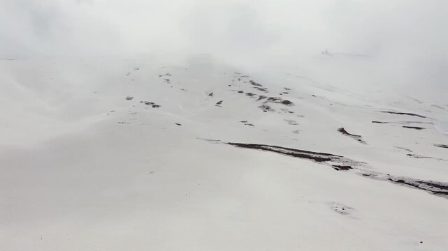 Aerial view of Campocatino ski resort in winter fog, Italy