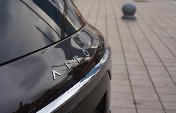 Dalian, China - September 18, 2026 : Close-up of the AITO M9, a Chinese luxury SUV made by Seres in partnership with Huawei's HIMA alliance, showing its rear badge and chrome trim details.
