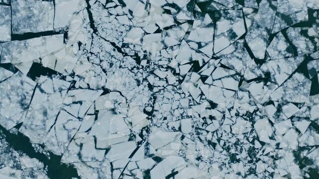 Floating ice Floes on the Frozen Surface of the River in Winter , Aerial Shot