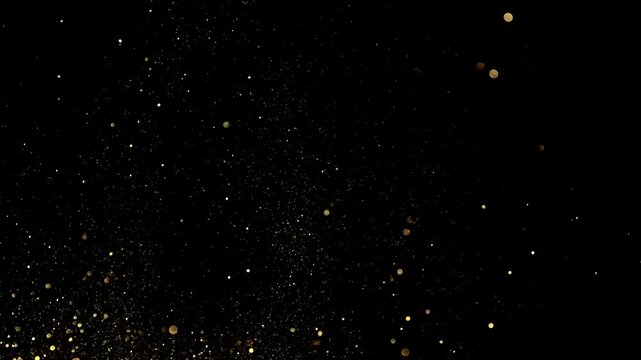 Abstract golden glitter particles flying through the air in super slow motion on a black background, captured at 1000 fps to reveal intricate movement, sparkle, texture, and dynamic detail
