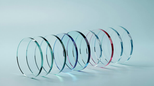 Alignment of clear glass circular lenses on a plain light background as PNG asset