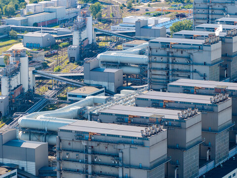 Aerial view of the Janschwalde Power Station industrial complex with large pipes and cooling structures in Peitz, Brandenburg, Germany.