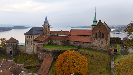 Drone aerial view of Akershus Castle medieval stone buildings, towers, and fjord in Oslo, Norway © Cirrus Height