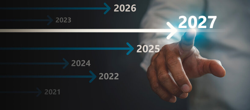 Business Strategy Timeline for Year 2027 with Businessman Pointing to Glowing Growth Arrow. 