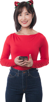 Happy young asian woman holding smartphone enjoying christmas sale shopping online during black friday promotional event isolated transparency background looking forward with joyful smile