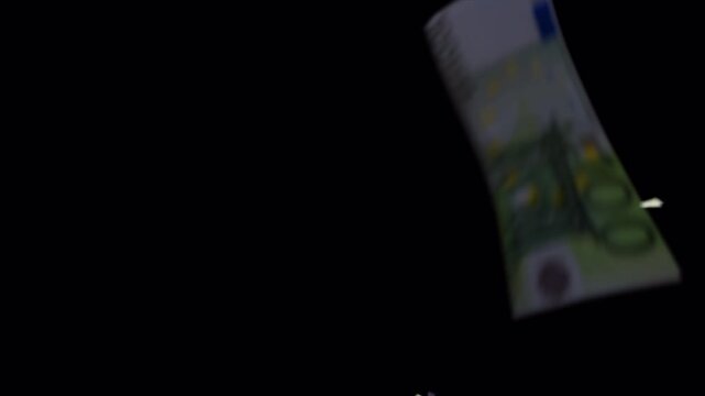 Abundant Currency Notes Falling Down Against Dark Background.