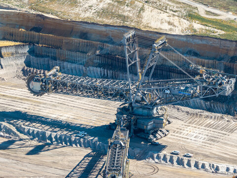 Aerial view of the massive bucket-wheel excavator at the Tagebau Welzow-Sud open-pit mine, showing industrial machinery and deep excavation layers in Spremberg, Brandenburg, Germany.