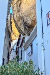 Setenil de las Bodegas is a famous cave house town featuring homes built beneath massive rock overhangs in Cadiz, Andalusia, Spain  © Olga Biliak