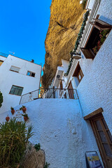 Setenil de las Bodegas is a famous cave house town featuring homes built beneath massive rock overhangs in Cadiz, Andalusia, Spain  © Olga Biliak