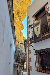 Setenil de las Bodegas is a famous cave house town featuring homes built beneath massive rock overhangs in Cadiz, Andalusia, Spain  © Olga Biliak