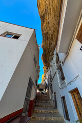 Setenil de las Bodegas is a famous cave house town featuring homes built beneath massive rock overhangs in Cadiz, Andalusia, Spain  © Olga Biliak
