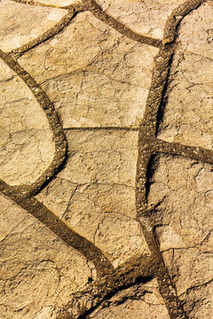 Mud cracks at Mesquite Sand Dunes in Death Valley National Park, California, USA.