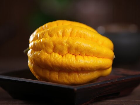 Whole Yellow Pattypan Squash on Dark Wooden Tray