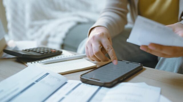 Visible activity presents smart phone, receipt, and calculator in a practical sequence. smart phone supports expense and tracking, while receipt remains central to the action Objects remain visible.