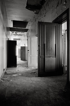 Doors in a decrepitude hall, light at the end
