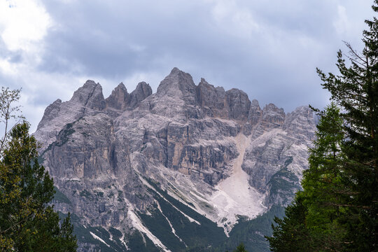 Stunning view of steep cliff of Monte Cristallo massif north face, in Ampezzo Dolomites Natural Park in summer, Belluno, Veneto, South Tyrol, Italy