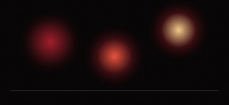 Abstract soft glowing spheres with red and golden hues on black red light golden glow light orbs