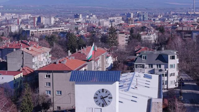 Aerial view of the clock tower with the Bulgarian flag in the city center of Shumen, Shumen Province, Bulgaria.