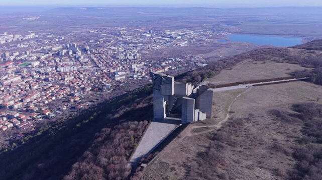 Aerial view of the massive concrete Founders of the Bulgarian State Monument overlooking the city of Shumen, Shumen Province, Bulgaria.