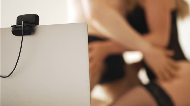 Sensual couple working as online webcam models.