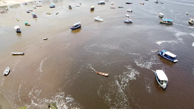 Drone footage aerial view boats on shallow water, Praia da Coroa, Itacare, Bahia state, Brasil