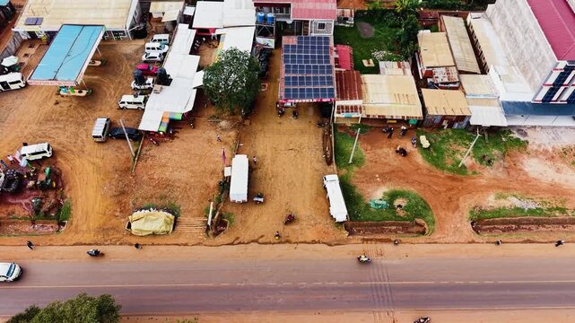 Panoramic view of the drone flying over the concentrated slum houses of rural village in Kenya. Aerial view of a poorly concentrated village in Africa slum of kiminini.