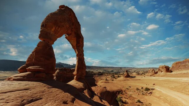 Time lapse video loop of Delicate Arch cloud sky. Scenic Arches National Park landscape, Utah, USA