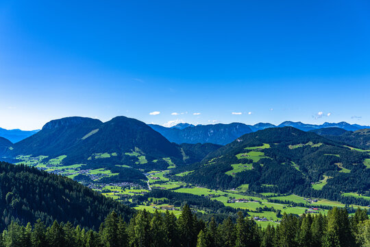 Beautiful panorama view of Soelllandl valley and Tyrolean Alps from mountain Brandstadl in summer on sunny day, Scheffau, Tyrol, Austria