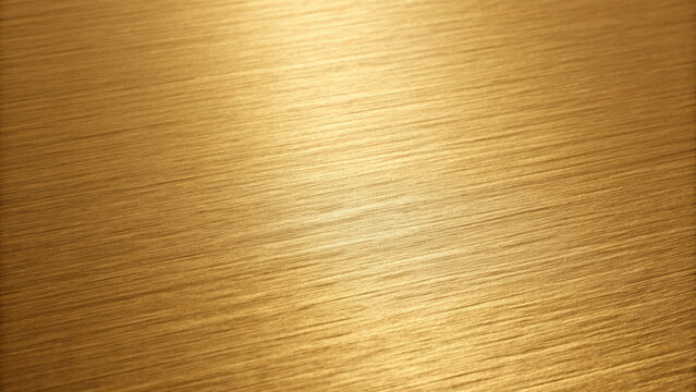 Brushed gold texture with diagonal light creating a luxurious metallic surface background