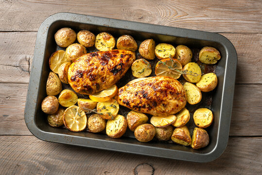 Oven roasted lemon garlic chicken and baby potatoes with herbs