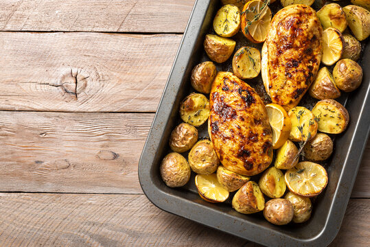 Oven roasted lemon garlic chicken and baby potatoes with herbs