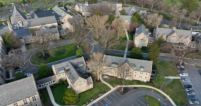 Aerial view of stone buildings with slate roofs surrounded by green lawns and parking lots in West Donegal Township, Pennsylvania, United States.