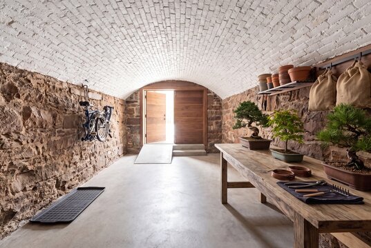 Narrow Brownstone Basement Garage With Bonsai Workbench and Brick Vault
