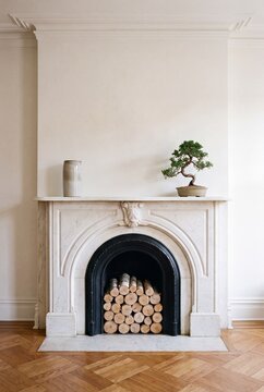 Small White Marble Mantel With Ceramic Vessel and Bonsai in Bedroom