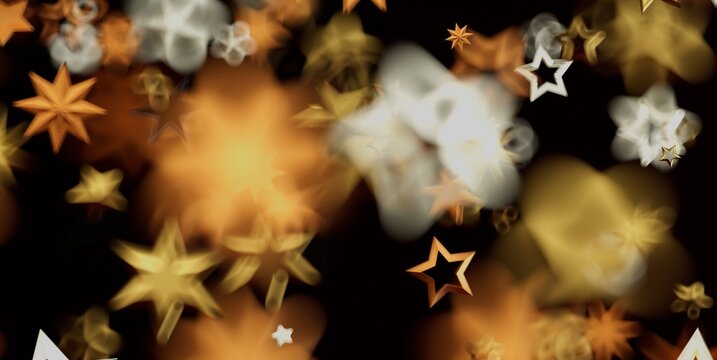 Abstract background featuring golden star-shaped lights and soft bokeh effect.