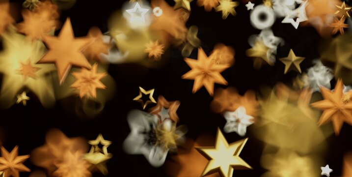 Abstract background with golden and white stars creating a festive bokeh effect.