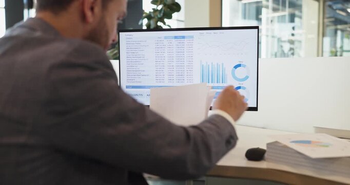 Accountant analyst businessman in office computer dashboard. He reviews a financial report, checking charts and spreadsheet data for accuracy, trends, and analysis. Clear finance data theme set.