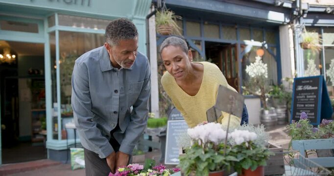 Senior Couple Shopping for Garden Plants Together