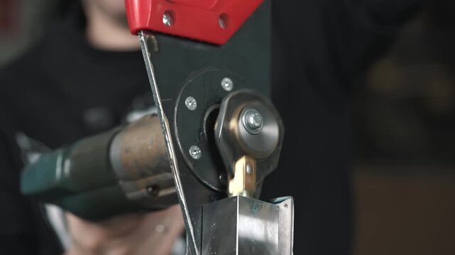 Slow-motion footage of the transmission mechanism of a homemade electric pruner in operation.