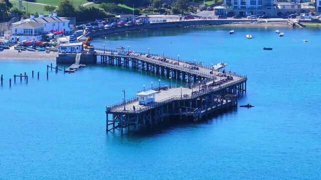 Aerial shot of Swanage Pier and seafront on a calm sunny day