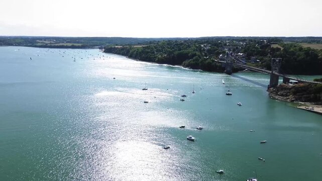 Aerial view of Pont Saint-Hubert and sailboats on the Rance estuary near Saint-Jean, Brittany, France.