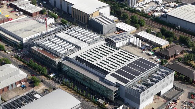 Aerial drone view of Slough industrial estate in the UK, featuring a major cluster of data centers, power infrastructure and facilities supporting AI, cloud computing and digital services.