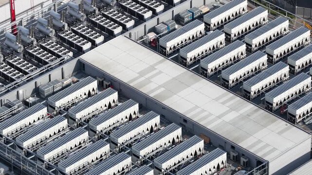 Aerial drone view of Slough industrial estate in the UK, featuring a major cluster of data centers, power infrastructure and facilities supporting AI, cloud computing and digital services.
