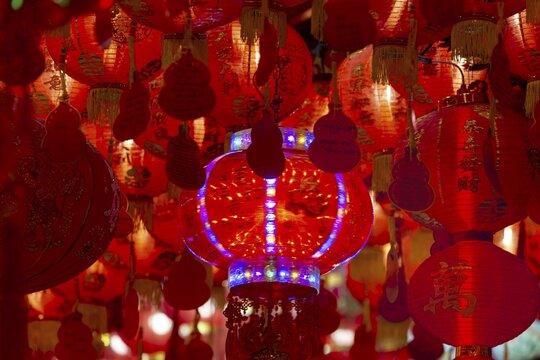 Chinese red hanging lanterns, as offerings, donations and good luck symbols in Wat Mangkon, an important Sino-Thai temple, Chinatown, Bangkok, Thailand