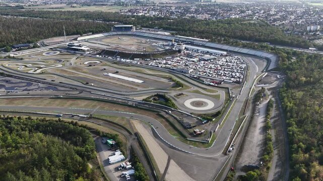 Aerial drone view of the Hockenheimring Baden-Wurttemberg in Germany, showing the famous motor racing circuit, grandstands, track layout and motorsport infrastructure.