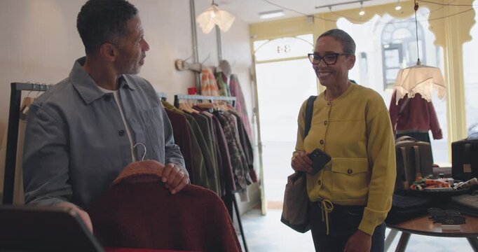 Senior Couple Shopping for Stylish Outerwear Together