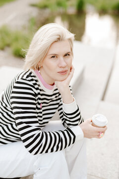Young beautiful woman person are happy and enjoy with coffee drink in the morning at park