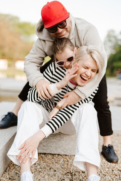 Young family with their daughter at park having fun together