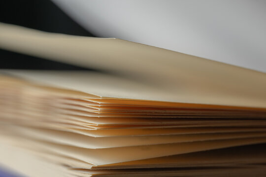 Open book showing pages, brown paper texture with abstract background, concept of education, knowledge, and wisdom