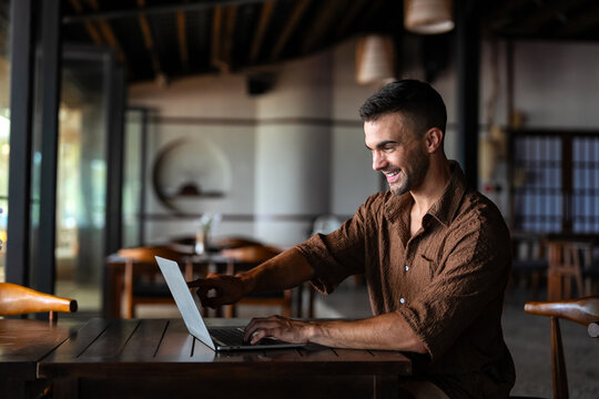 Digital success, a waiter uses a tablet for efficient service in restaurant showcasing technology